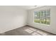 Bedroom with a neutral color scheme and a large window allowing for ample natural light at 1631 Wilford Ln, Indianapolis, IN 46229