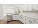 Kitchen view featuring stainless steel dishwasher, sink and white cabinetry at 1631 Wilford Ln, Indianapolis, IN 46229