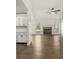 Bright living room with hardwood floors, brick fireplace, and abundant natural light at 1631 Wilford Ln, Indianapolis, IN 46229