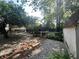 Backyard view featuring a stone path, gravel ground cover, and a rustic wooden fence at 177 Wellington Pkwy, Noblesville, IN 46060