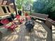 Backyard deck with fire pit, outdoor seating, and charming decor at 177 Wellington Pkwy, Noblesville, IN 46060