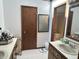 Dual sink bathroom with tiled floors, vanity space, and a doorway to the adjacent shower room at 177 Wellington Pkwy, Noblesville, IN 46060