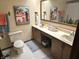 Functional bathroom features double sinks, linoleum floors, decorative art, and toilet at 177 Wellington Pkwy, Noblesville, IN 46060