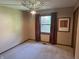 Spare bedroom with neutral walls, unique light fixture, and a window with natural light at 177 Wellington Pkwy, Noblesville, IN 46060