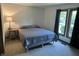 Cozy bedroom features soft carpet, a comfortable queen-sized bed, and a well-lit window for natural light at 177 Wellington Pkwy, Noblesville, IN 46060