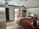 Bright bedroom with vaulted ceilings, wood trim and a view into the en-suite bathroom at 177 Wellington Pkwy, Noblesville, IN 46060