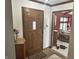 The front entry features a solid wood door with adjacent entryway into living room at 177 Wellington Pkwy, Noblesville, IN 46060