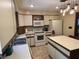 Modern kitchen featuring white appliances, an island with seating and plenty of cabinet space at 177 Wellington Pkwy, Noblesville, IN 46060