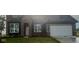 Beautiful two-story home featuring a brick and siding exterior, a two car garage, and a well manicured lawn at 18956 Seaforth Way, Westfield, IN 46074