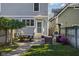 Backyard patio with outdoor seating area, grill, and manicured lawn at 2016 Central Ave, Indianapolis, IN 46202