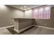 Finished basement bar area with dark countertop and decorative window curtain at 2016 Central Ave, Indianapolis, IN 46202