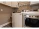 Bright laundry room featuring a modern washer and dryer, plus ample storage space and neutral wall paint at 2016 Central Ave, Indianapolis, IN 46202