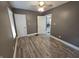 This is a bedroom with luxury vinyl plank flooring and neutral gray walls at 2035 S Pennsylvania St, Indianapolis, IN 46225
