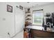 Bright bedroom featuring a large window, a closet with folding doors, and a wood desk at 2145 W Autumn Ln, Columbus, IN 47201