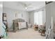 Cozy bedroom with a crib, rocking chair, and toys at 2145 W Autumn Ln, Columbus, IN 47201