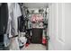 Walk-in closet well stocked with clothes on rods and shelves, with a dresser at 2145 W Autumn Ln, Columbus, IN 47201