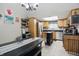 Bright eat-in kitchen featuring stainless steel appliances, a movable island, and wood cabinetry at 2145 W Autumn Ln, Columbus, IN 47201