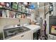 Laundry room featuring a front-load washer and dryer, and metal shelving at 2145 W Autumn Ln, Columbus, IN 47201