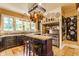 A rustic kitchen with a butcher block island, stainless steel appliances, and pot rack at 224 N Pennsylvania St, Greenfield, IN 46140
