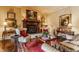 Warm and inviting living room with a fireplace, classic artwork, and comfortable seating arrangements at 224 N Pennsylvania St, Greenfield, IN 46140