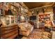 Elegant living room with built-in bookshelves, mounted deer heads, and a cozy leather couch at 224 N Pennsylvania St, Greenfield, IN 46140