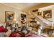 Warm and inviting living room with a fireplace, classic artwork, and comfortable seating arrangements at 224 N Pennsylvania St, Greenfield, IN 46140