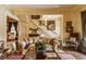 Cozy living room with elegant decor, featuring a staircase, classic artwork, and comfortable seating at 224 N Pennsylvania St, Greenfield, IN 46140