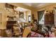 Elegant living room with a staircase, classic artwork, comfortable seating, and a view to another room at 224 N Pennsylvania St, Greenfield, IN 46140