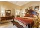 Luxurious main bedroom with ornate headboard, sitting area, and ensuite bathroom at 224 N Pennsylvania St, Greenfield, IN 46140