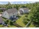 Aerial view of backyard featuring a patio, trampoline, and fenced yard at 2326 Gradison Cir, Indianapolis, IN 46214