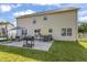 Backyard showing outdoor seating, grill, and lawn at 2326 Gradison Cir, Indianapolis, IN 46214