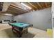 Finished basement featuring a billiards table, perfect for entertainment and relaxation at 2326 Gradison Cir, Indianapolis, IN 46214