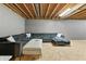 Finished basement with a comfortable sectional, perfect for relaxation and entertainment at 2326 Gradison Cir, Indianapolis, IN 46214