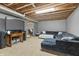 Finished basement with a large sectional, entertainment center, and drop ceiling, perfect for a cozy Gathering room at 2326 Gradison Cir, Indianapolis, IN 46214