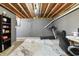 Basement area equipped with a treadmill and office space for fitness and work at 2326 Gradison Cir, Indianapolis, IN 46214