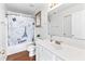 Well-lit bathroom featuring a vanity with white cabinets and a Paris themed shower curtain at 2326 Gradison Cir, Indianapolis, IN 46214