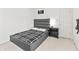 This is a stylish bedroom with a modern platform bed and minimalist decor at 2326 Gradison Cir, Indianapolis, IN 46214