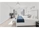 Well-lit bedroom featuring a large bed, stylish decor, and windows providing ample natural light at 2326 Gradison Cir, Indianapolis, IN 46214