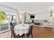 Open concept dining area with backyard view, a fireplace, and cozy living room with ample natural light at 2326 Gradison Cir, Indianapolis, IN 46214