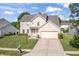 Charming two-story home featuring a combination of brick and vinyl siding with an attached two car garage at 2326 Gradison Cir, Indianapolis, IN 46214