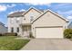 Attractive two-story home with a well-manicured lawn, brick accents, and an attached two-car garage at 2326 Gradison Cir, Indianapolis, IN 46214