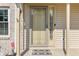 Charming front door with decorative glass panel and 'Welcome' mat at 2326 Gradison Cir, Indianapolis, IN 46214