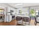 Well-lit kitchen featuring white cabinets, stainless steel appliances, and a center island with seating at 2326 Gradison Cir, Indianapolis, IN 46214