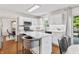 Modern kitchen with white cabinets, stainless steel appliances, and a center island with seating at 2326 Gradison Cir, Indianapolis, IN 46214