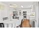 Bright kitchen with stainless steel appliances, an island, and a table with a white tablecloth at 2326 Gradison Cir, Indianapolis, IN 46214