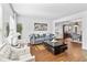 Bright living room with hardwood floors, neutral walls, and tasteful furniture at 2326 Gradison Cir, Indianapolis, IN 46214