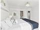 Large, well-lit bedroom with a king-size bed, decorative accents, and an open doorway to the ensuite bathroom at 2326 Gradison Cir, Indianapolis, IN 46214