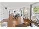 Bright, open-concept living space with dining area, kitchen, and a view to the backyard through sliding glass doors at 2326 Gradison Cir, Indianapolis, IN 46214
