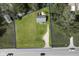 Aerial view of a lot with a blue border, home, shed and driveway along a street with passing cars at 2710 W State Road 38, Sheridan, IN 46069
