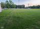 Large, well-maintained backyard featuring lush green grass and ample space for outdoor activities at 2710 W State Road 38, Sheridan, IN 46069